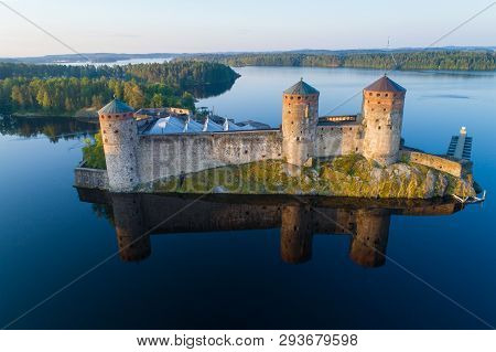 The Old Olavinlinna Fortress In The Morning Summer Landscape (aerial Photography). Savonlina, Finlan