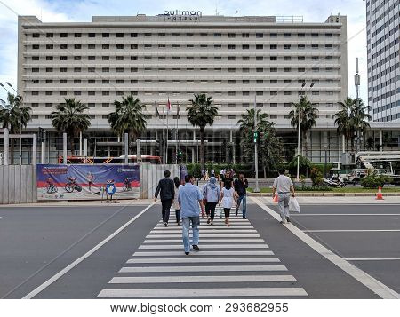 Jakarta, Indonesia - February 16, 2019: Some People Walking On The Pelican Crossing On Jalan Thamrin