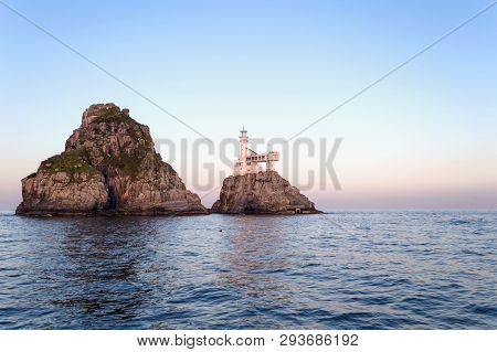 View On Deungdaedo (lighthouse) Island In Busan From The Sea In The Evening