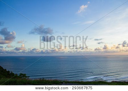 Paragliding Hill Watugupit At Yogyakarta, Beautiful View Of Hill And Sea With Blue Sky And Clouds