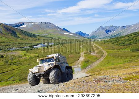 Yamal, Russia - August 27, 2018: Trеkol All-terrain Vehicle Climbs The Mountain In The Foothills Of 