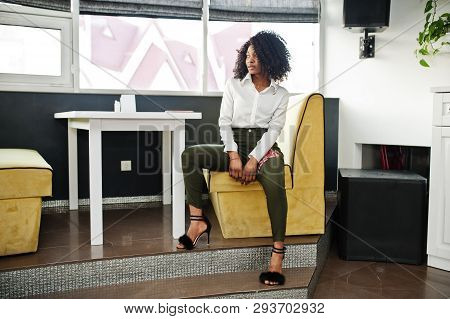 Сheerful Business African American Lady With Afro Hair, Wear White Blouse And Green Pants Posed In C