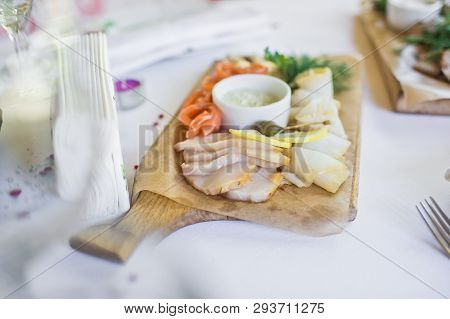 Slices Of Various Salted Fish - Salmon, Muksun, Oily Fish On Wooden Cutting Board. Restaurant