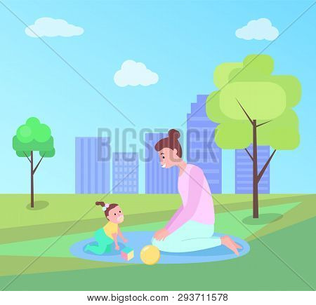 Woman Playing With Baby On Mat Outdoor, Mother And Daughter Sitting On Grass Near Trees, Funny Time,
