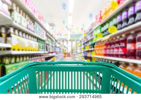 Closeup Shopping Basket Green Color With Blurred Suppermarket Background