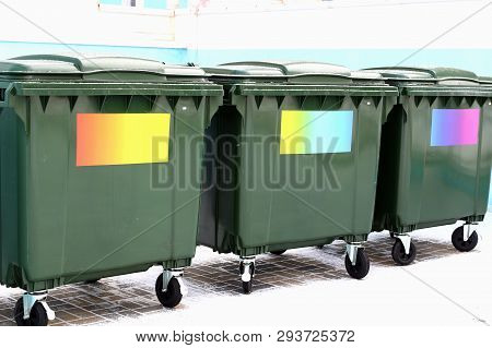 Separate Waste Collection. Green Garbage Cans Without Labels With Colored Stickers