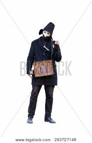 A Street Musician With A Hurdy-gurdy In The Mask Dressed In Black Clothes With Black Hat Isolated On