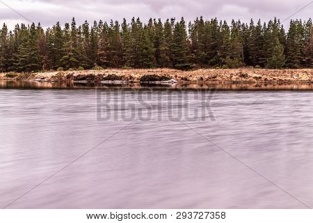 Sunset In Conemara Lake With Pine Forest Around