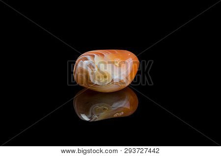 Orange Agate Isolated Black Background With Mirror Reflection