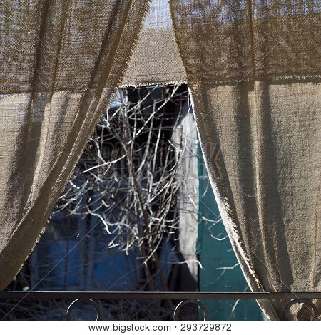 Closeup Of Veranda With Baldachin Against The Sunlight Or Insects