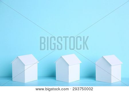 Paper Town. Papercraft House And Papercraft Building On Blue Background