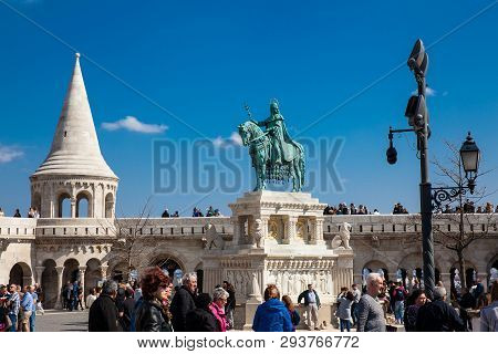 Budapest, Hungary - April, 2018: Tourists And The St. Stephen King Statue At Fisherman Bastion A Ter