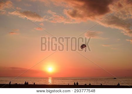 Parasaler Over The Sea In The Sunset Light.