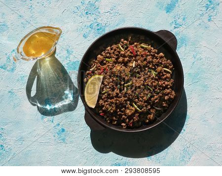 Indian Minced Meat Qeema On A Sunny Blue Table. Top View.