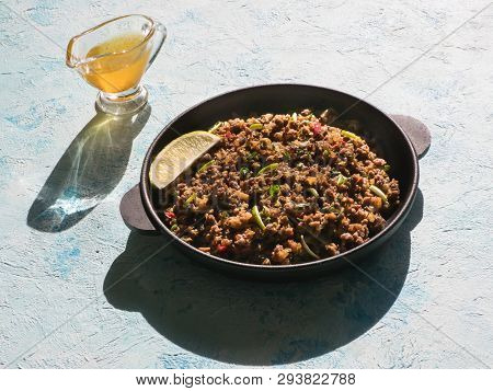 Indian Minced Meat Qeema On A Sunny Blue Table. Top View.