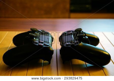 22.03.2019 Eskisehir, Turkey. Two Ps4 Gamepads On Wooden Background Close Up View