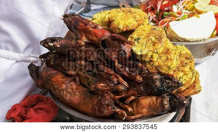 Freshly Cooked Cuy, Guinea Pig, At A Market In Cuzco