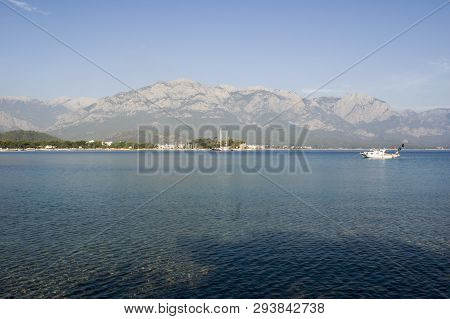 Kemer Antalia Nice View Of The Sea. Beach Kemer Antalia With Sand And Mountains, The Sea With The Sh