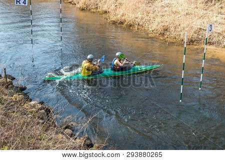 Grodno, Belarus - April, 2019: Kayak Freestyle Competition On Fast Cold Water River Strenuously Rowi