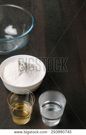 Baking Wooden Background With Ingredients For Pizza Dough. Baking Utensils On Dark Rustic Table, Top