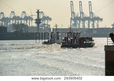 Hamburg, Germany - March 30, 2019: Ship Tugs And Excursion Ship Drive Up The Elbe In The Hamburg Har