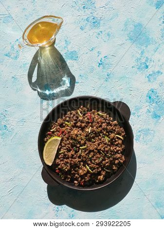 Indian Minced Meat Qeema On A Sunny Blue Table. Top View.