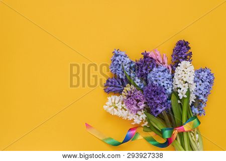 Hyacinth Flowers Bouquet On Yllow Background. Top View, Copy Space.