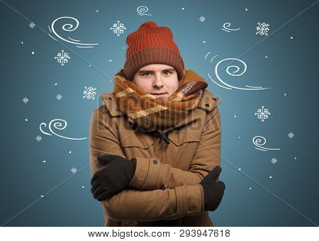 Young hipster frozen boy with doodled snowflakes and windy concept