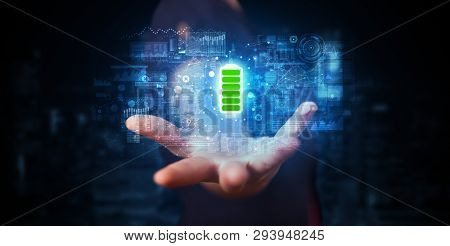 Elegant hand holding battery with full of energy