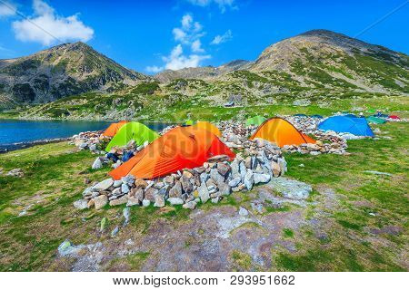 Splendid Alpine Campground With Colorful Tents Near Bucura Glacier Lake. Spectacular, Fantastic Moun