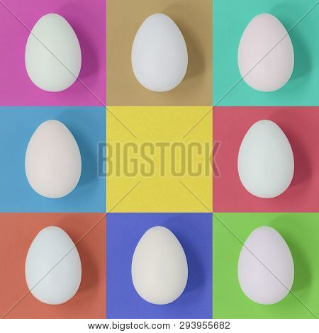 White Easter Eggs On A Pastel Multicolor Square Background, With Copy Space In The Centre