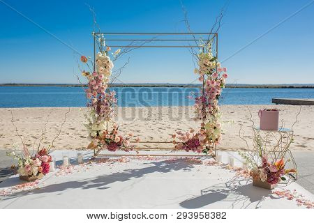 Event Decoration. Wedding Chuppa At Riverside Decorated With Fresh Flowers. Florist Workflow.