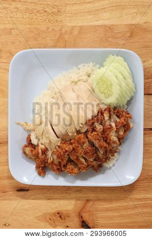 Hainanese Chicken Rice With Roasted Chicken On Wooden Table.hainanese Chicken Rice Is A Dish Of Poac