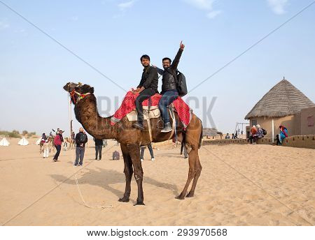 Bikaner, India - January 12, 2019: Tourists Riding On Camel In Tahr Desert In Rajasthan State