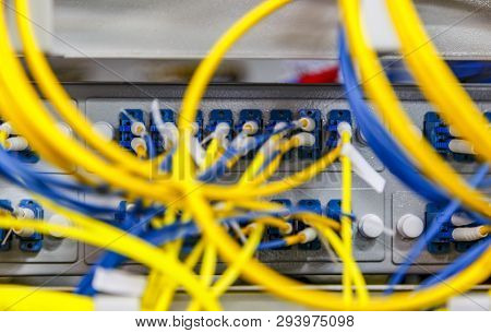 Network Server Room Routers With Fusebox Panel Blurred Front Background. Datacentre Interface And Eq