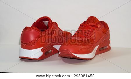 Close-up, On A White Background, Red Sneakers, With A White Sole, With A Shadow