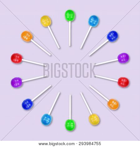 Set Of Colorful Lollipops Grouped In A Circle Isolated On Light Purplebackground. Candy On A Stick. 