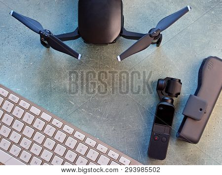 Kharkiv, Ukraine - April 7, 2019: Dji Osmo Pocket, Dji Drone, Computer Keyboard On A Table. Travel B