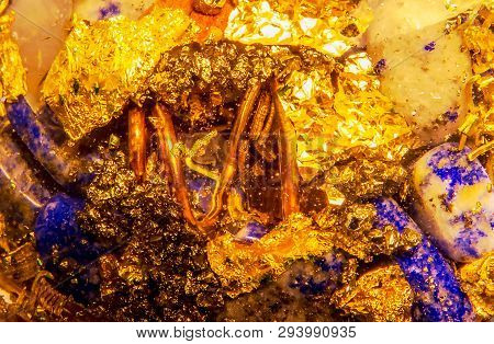 Detailed Close-up Photo Of An Orgone Made Of Blue Lapis Lazuli, Copper, Brass, And Gold.