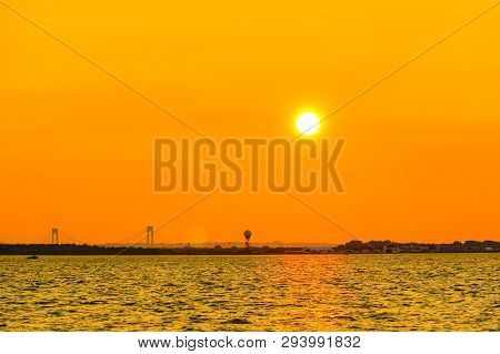 Orange Dusk In New York With Verrazzano-narrows Bridge View.