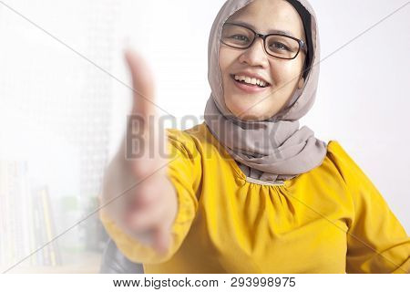 Portrait Of Muslim Businesswoman Offers Hand Shake, Deal Partnership Agreeement Concept, Selective F