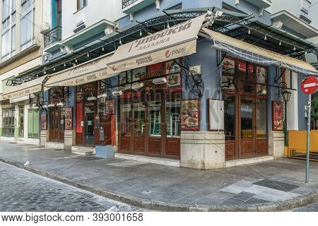 Thessaloniki, Greece - November 02 2020: Closed Tavern With Wooden Chairs Stacked Inside. Day View O