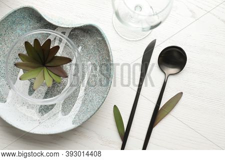 Elegant Table Setting With Floral Decor On White Wooden Background, Flat Lay