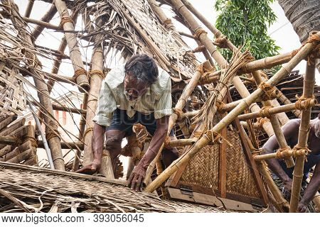 Puducherry, Tamil Nadu - December Circa, 2018. Unidentified Indian Workers Covered The Top Of The Lo