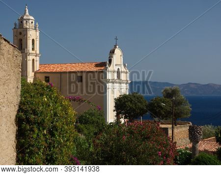 View On The Roman Catholic Church Of The Assumption In Cargese With The Sagone Bay Behind