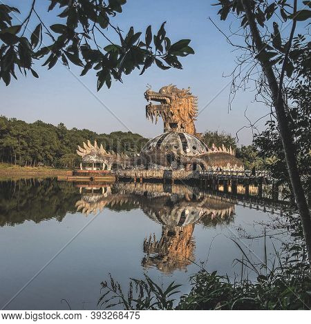 Hue, Vietnam, January 23, 2020, Dragon head in a abandoned Waterpark, Slide and swimming pool left behind, Hue, Vietnam