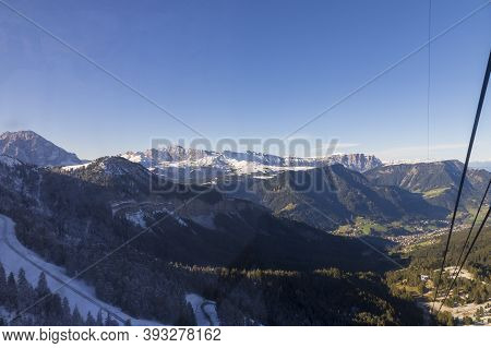 View From The Gondola Cabin To The Snow-capped Seceda Peaks In The Italian Dolomites.