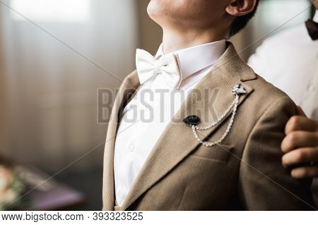 Grooms Morning Preparation. Handsome Man Getting Dressed And Preparing For The Wedding