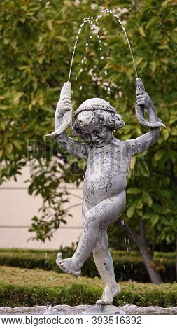 Kiev, Ukraine October 12, 2019: Sculpture Of A Fountain Boy With Fish On The Estate Of The Exiled Pr