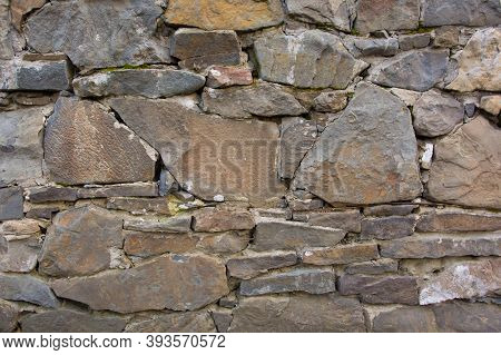 Castle Wall Made Of Old Stones. Castle Wall Made Of Old Stones Textures For Design And Photo Backgro